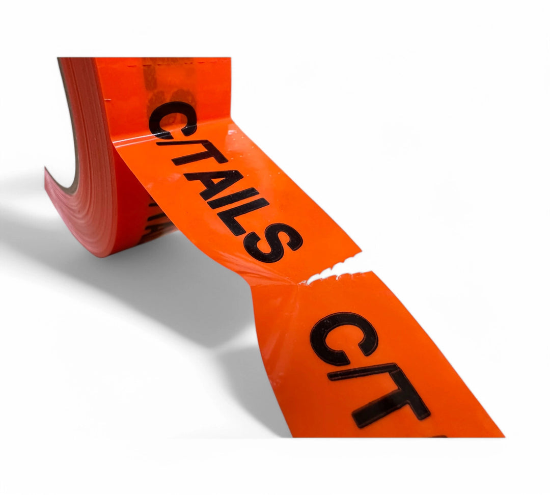C/TAILS Rip A Sticker 24mm x 50mm black on fluro orange shown with bright background for immediate attention
