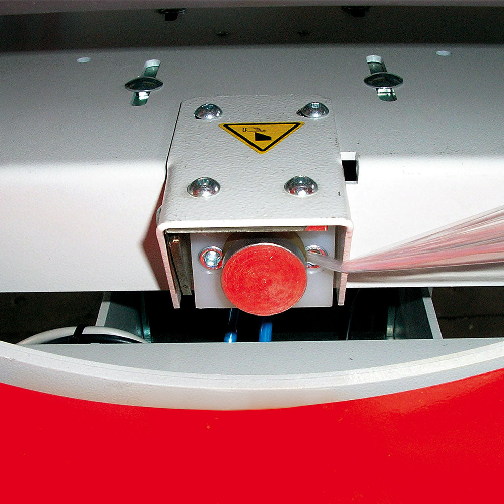 Close-up of the Evoring-A horizontal wrapper's automated fast film clamp and cutting claw mechanism for secure film handling during wrapping cycle