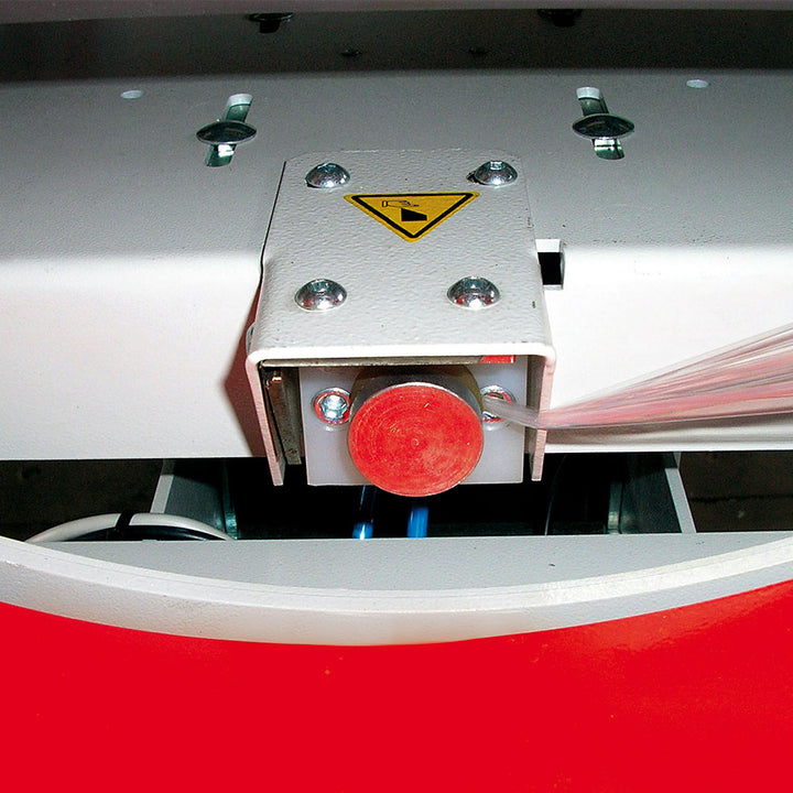 Close-up of the Evoring-A horizontal wrapper's automated fast film clamp and cutting claw mechanism for secure film handling during wrapping cycle