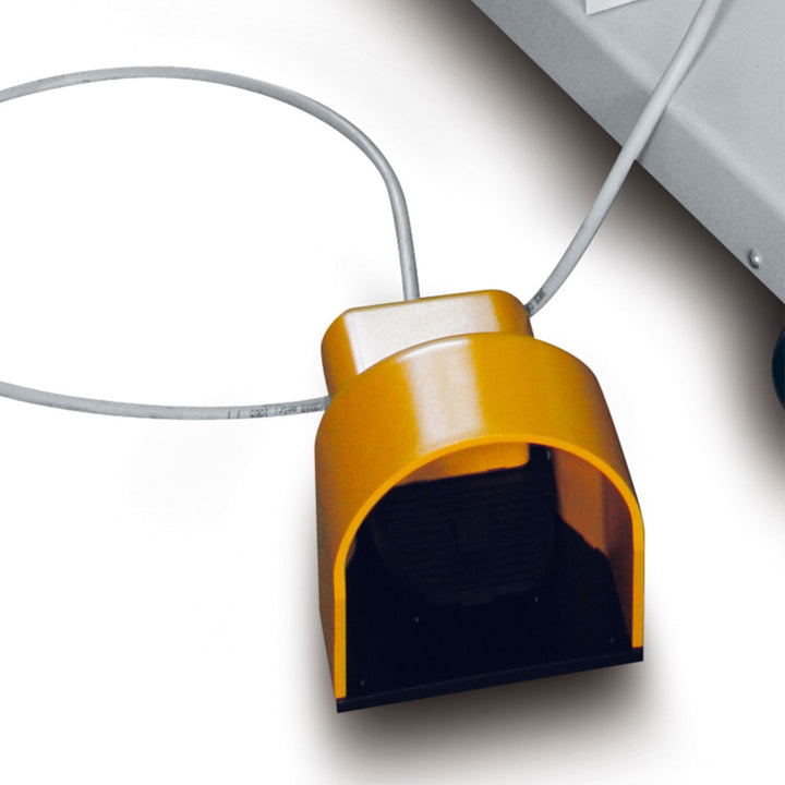 Close-up of the yellow foot pedal control for the Evoring-S semi automatic wrapping machine, used to start and stop the wrapping cycle
