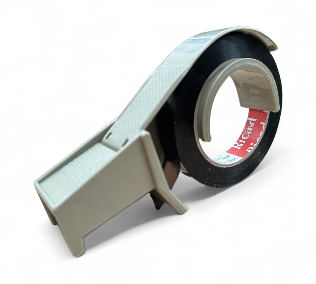 Grey 24 mm tape dispenser side view  -  durable desktop packaging tool for standard rolls