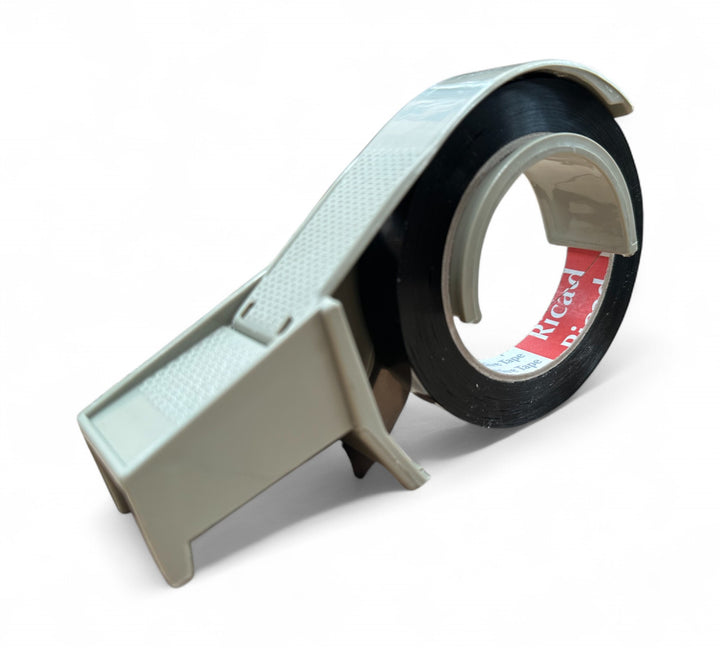 Grey 24 mm tape dispenser side view  -  durable desktop packaging tool for standard rolls