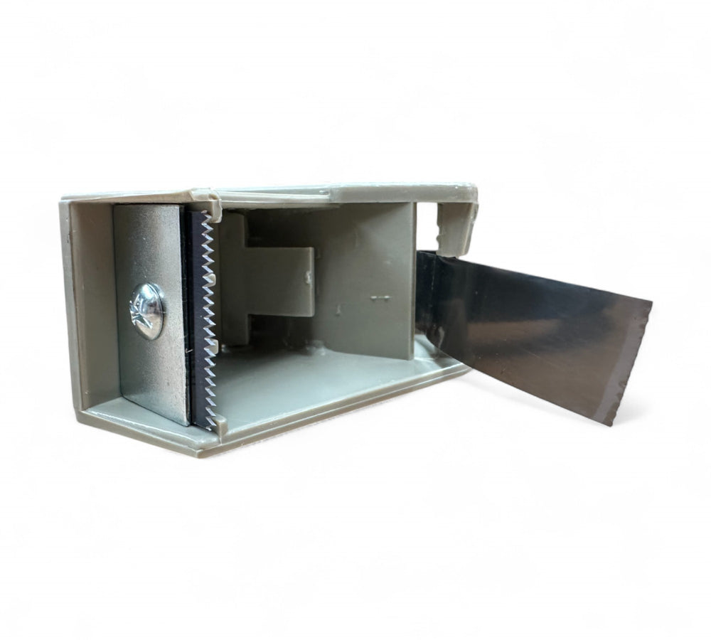 Close-up of 24 mm tape dispenser blade  -  sharp cutting edge for clean and precise tape application