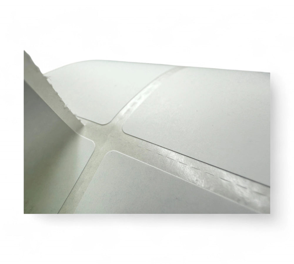 40 x 140mm white direct thermal labels in 2-across layout with peel-back adhesive, 2600 per roll
